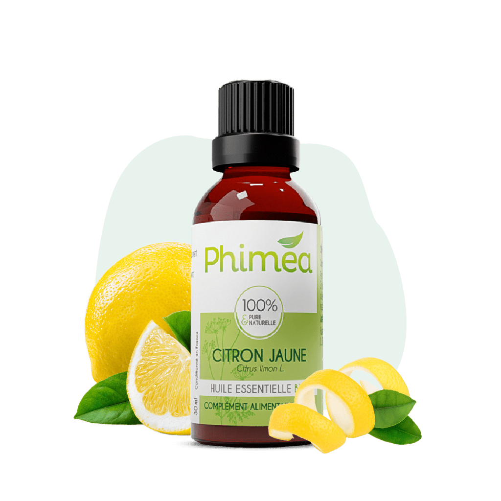 Flacon huile essentielle 30ml de citron jaune avec fruit en arrière plan sur fond vert
